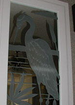 carved heron on mirror top — etched